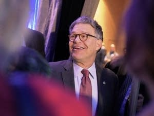 US Senator Al Franken turns to greet people.