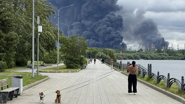 Black smoke rises from the area of the Russian oil producer Gazprom Neft's Moscow oil refinery on June 18.