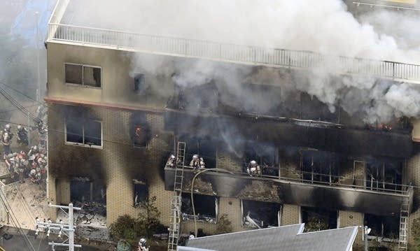 Firefighters respond to a building fire of Kyoto Animation in Kyoto. 