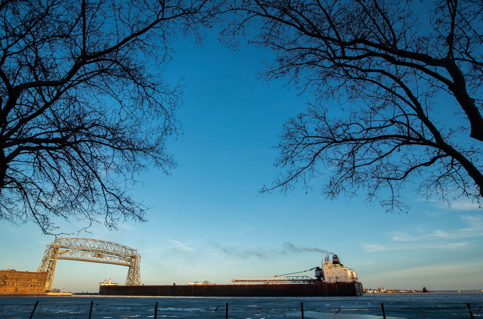 The 1004-foot long American Spirit passes under the aerial lift bridge