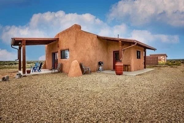 Laurel Santos' off-grid home in New Mexico sits on 55 acres of land and has cisterns for water collection and solar panels for power.