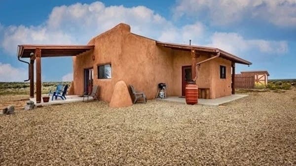 Laurel Santos' off-grid home in New Mexico sits on 55 acres of land and has cisterns for water collection and solar panels for power.