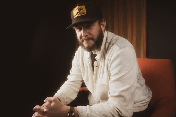 Justin vernon posing for photos