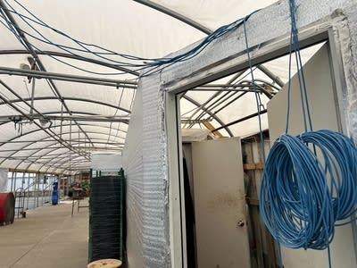 Wires hang from ceiling