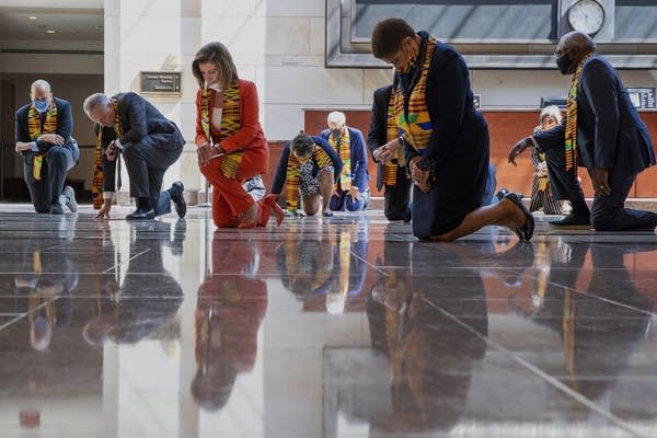 Members of Congress kneel in honor of George Floyd.