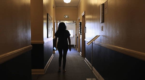 An undocumented immigrant walks through a corridor while taking refuge at the First Baptist Church in Denver, Colorado.