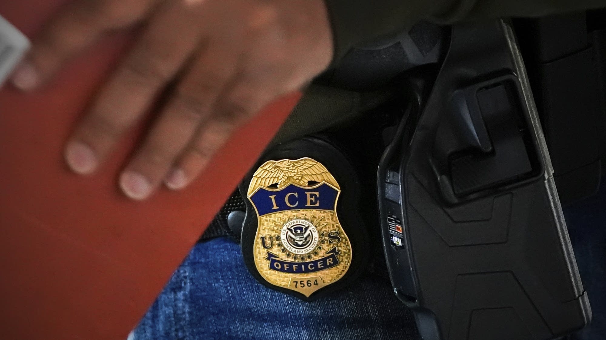 ICE officer charged with lying regarding shooting man