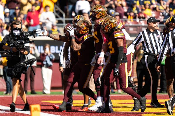 Minnesota beats Michigan 20-14 behind a dominant defense for a rare lift of the Little Brown Jug