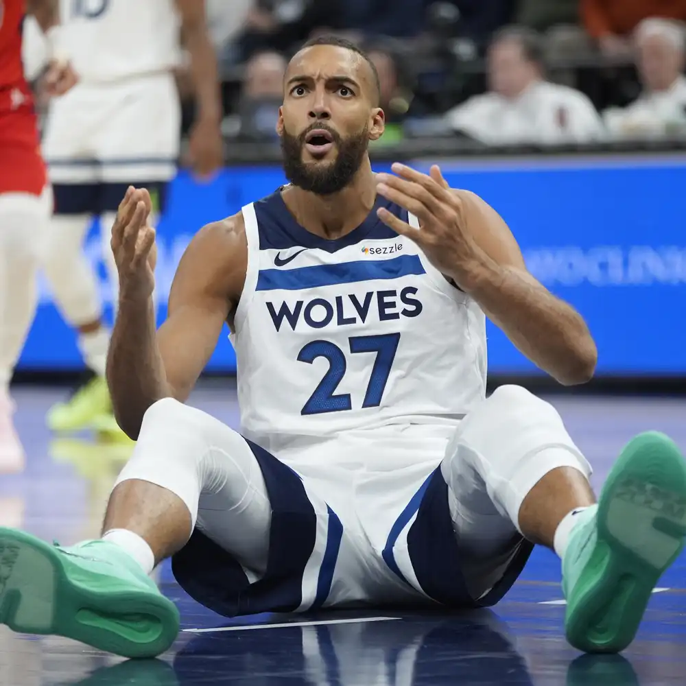 9ff4f5-20250320-man-sits-and-