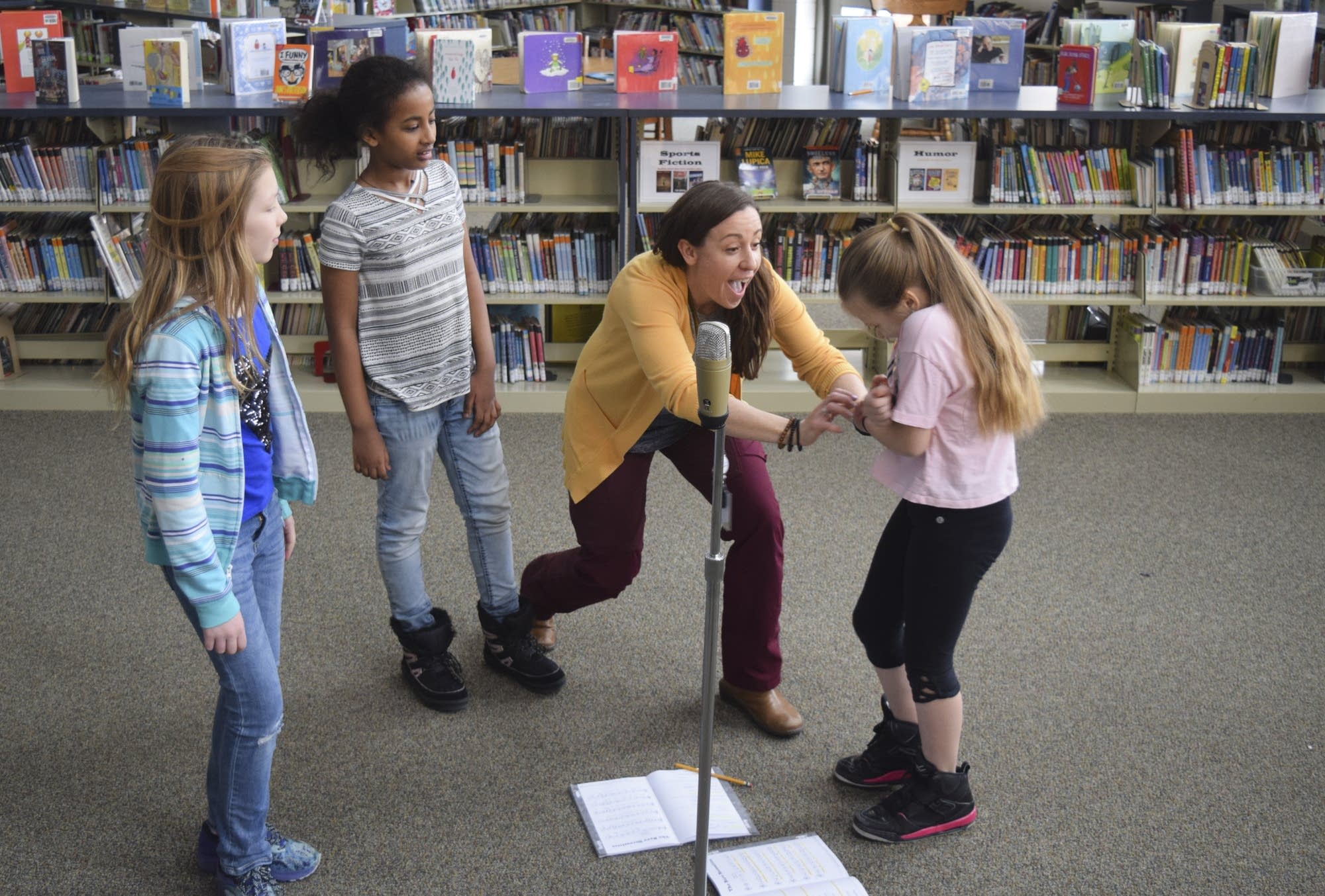 Aria Urban, 11, Tsedenia Bezie, 9, and Michelle Allen, 11, practice lines.