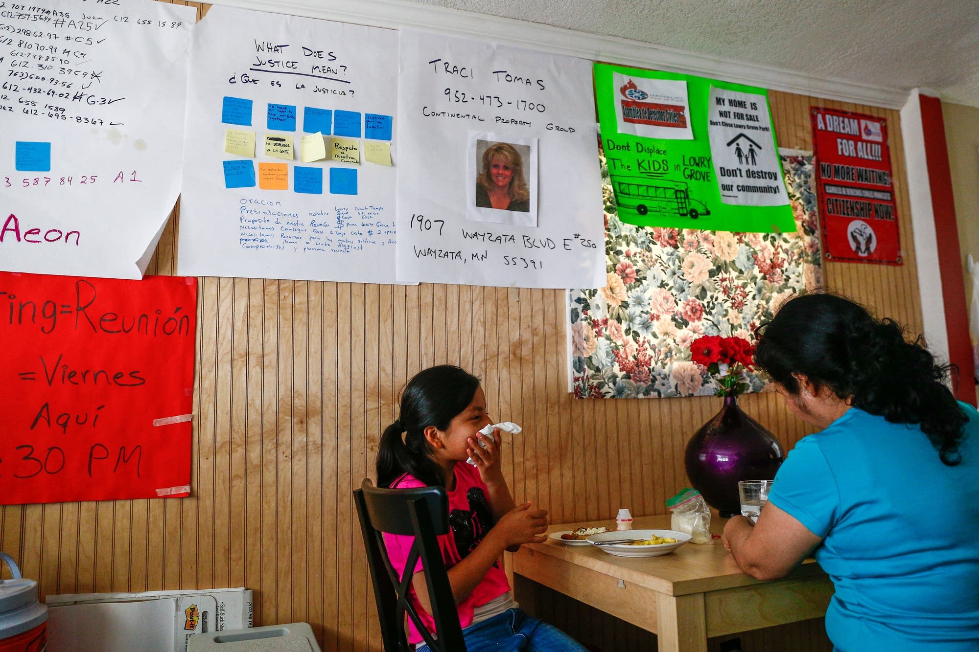 Antonia and Maria Alvarez eat in their home.
