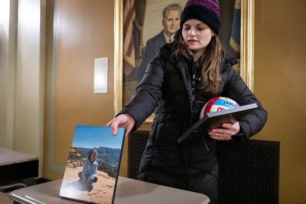 A woman holds a photo