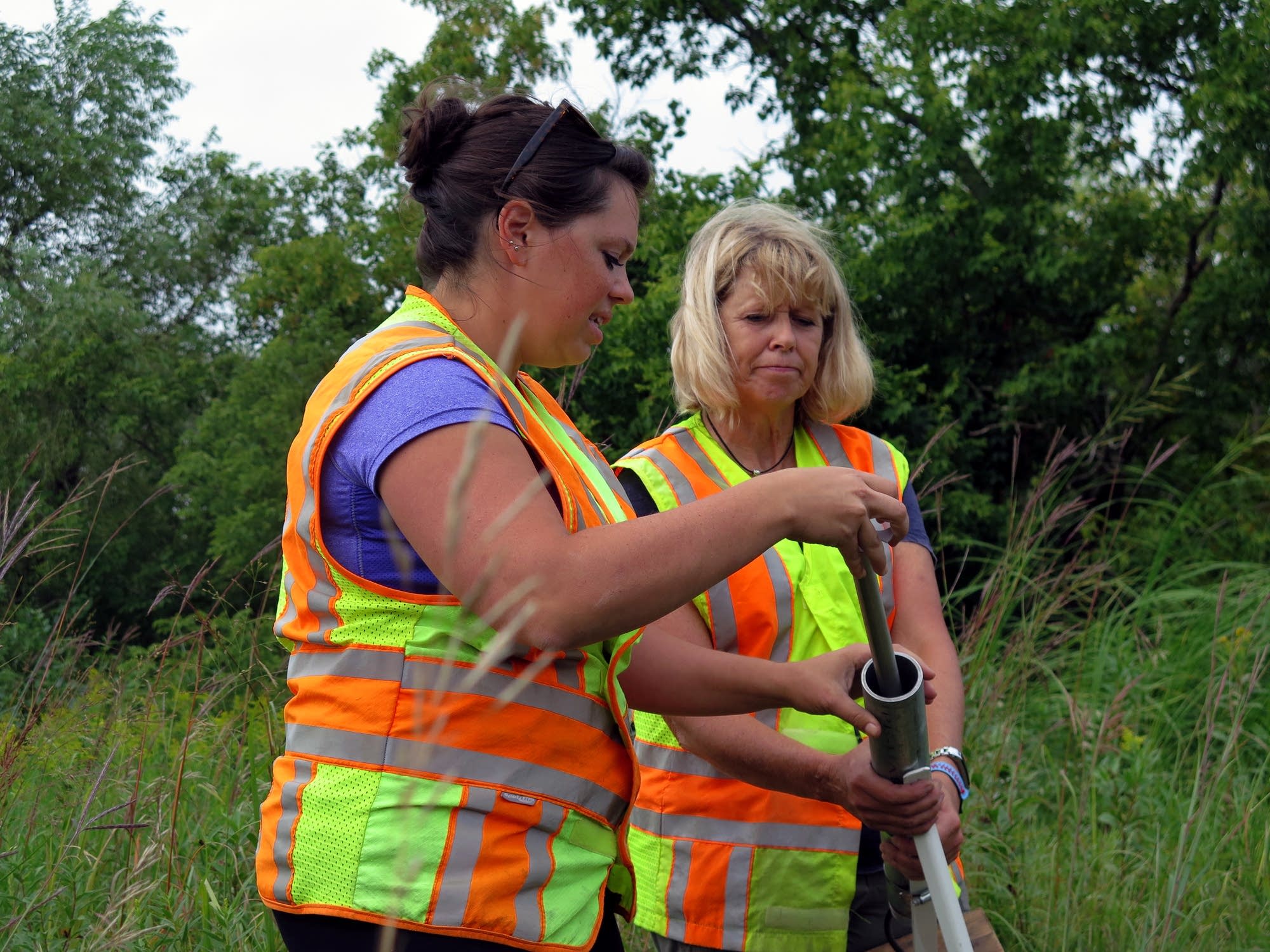 DNR hydrologists Erynn Jenzen, left, and Brenda Stauffer
