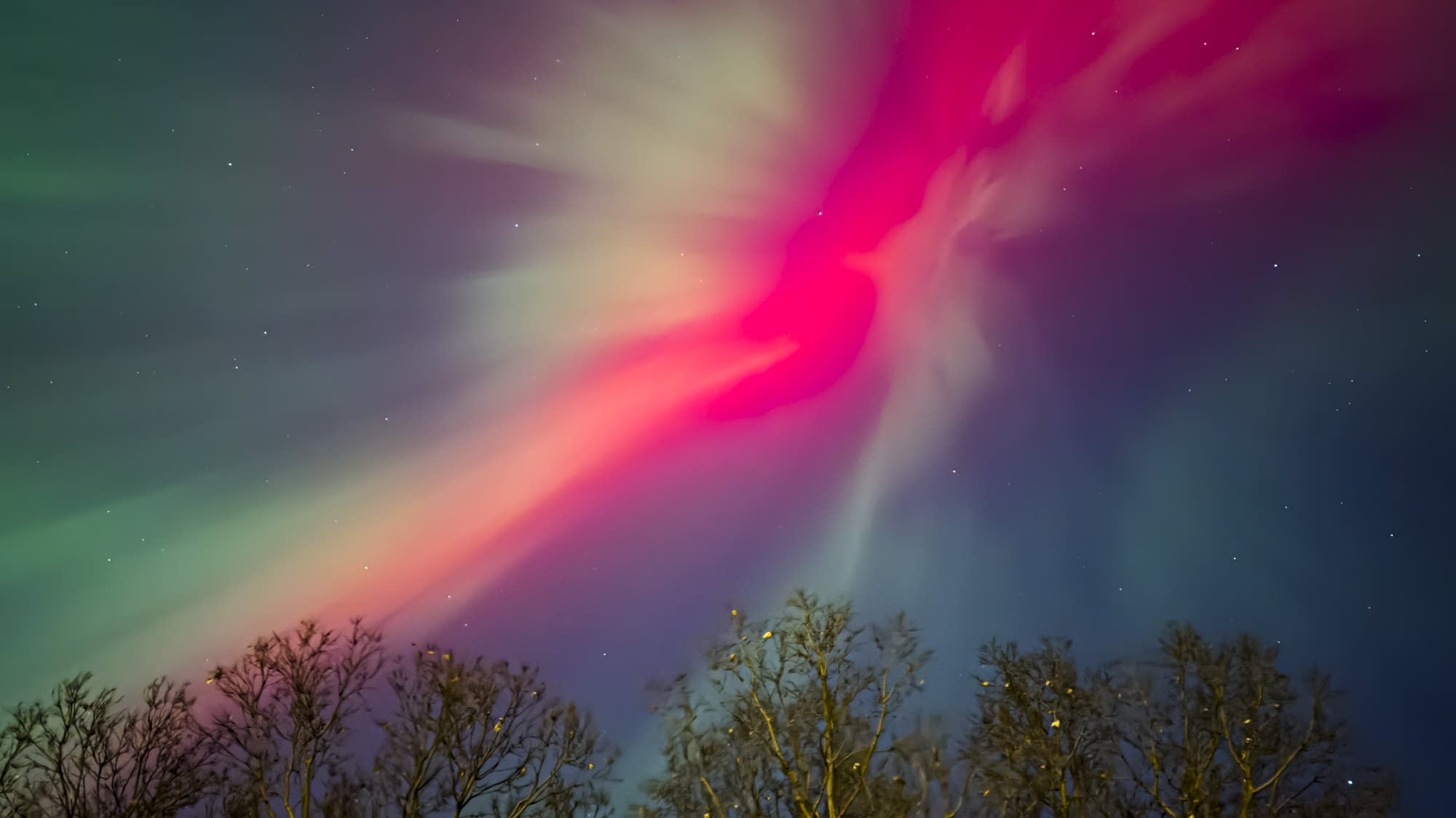 In vivid red and green, stunning aurora display sweeps across Minnesota skies