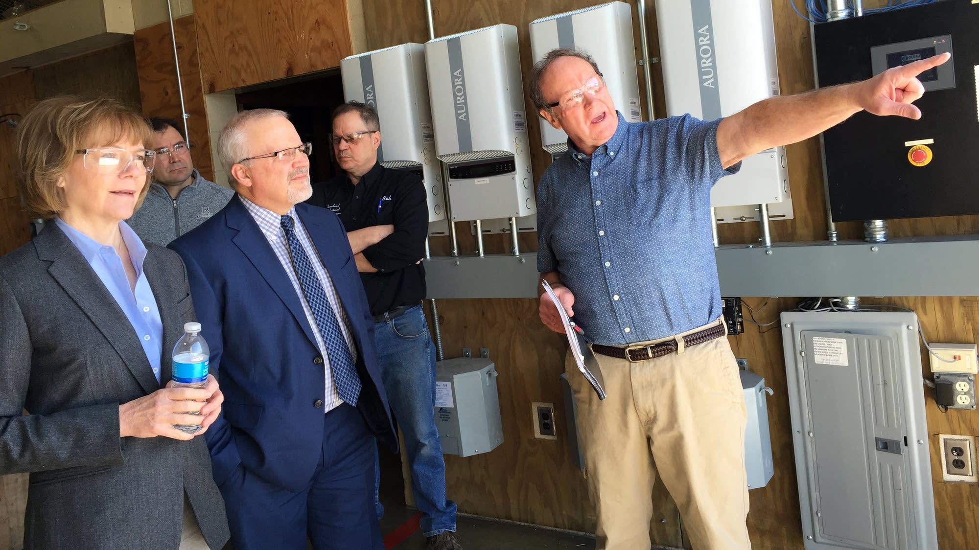 Steve Vietor points out the Riverland Community College's wind turbine.