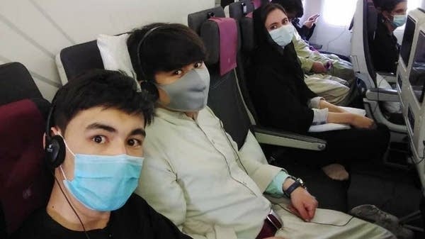 Poster Afghanistan National Institute of Music on plane to Doha
