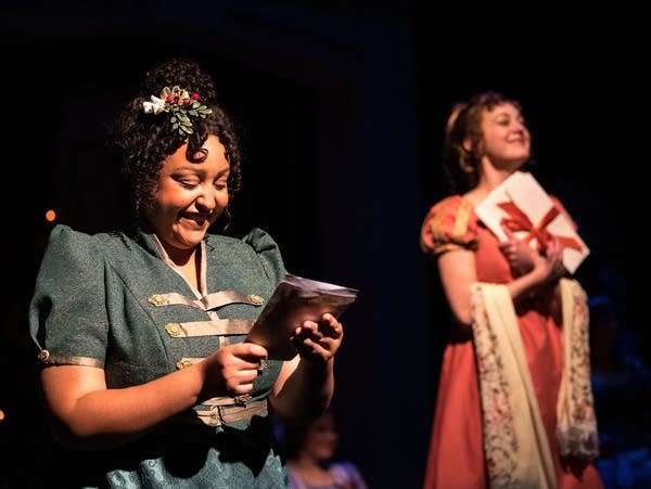 two woman on stage