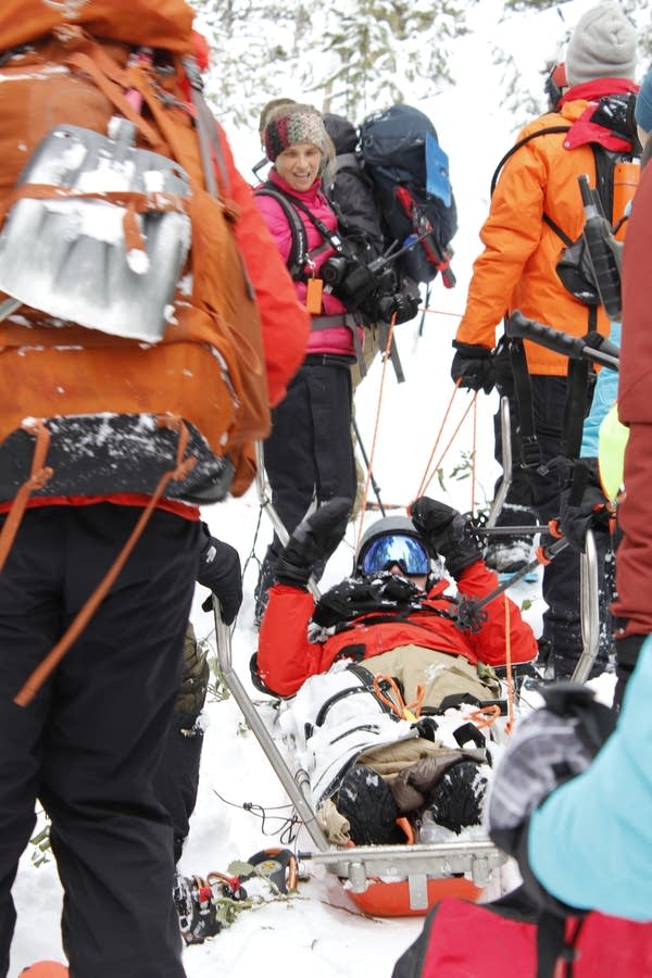 Idaho Mountain Search and Rescue Unit volunteers extract someone playing a lost snowshoer during a training exercise.