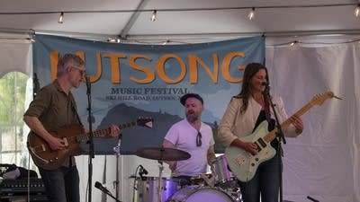 Molly Dean and band performing on stage