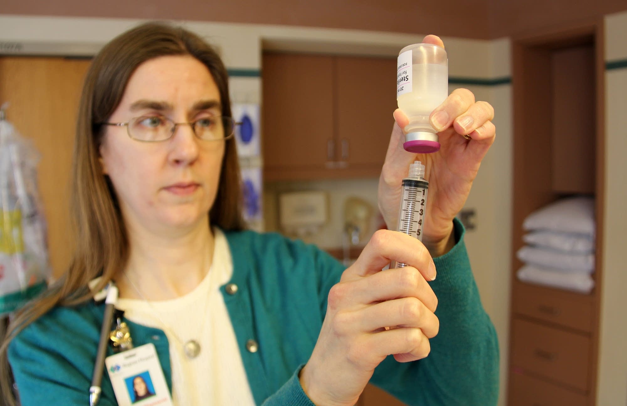 Sheri Ober demonstrates an IV bag alternatives called 'pushing.'