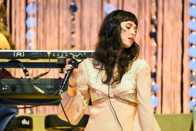 Clairo performing on stage