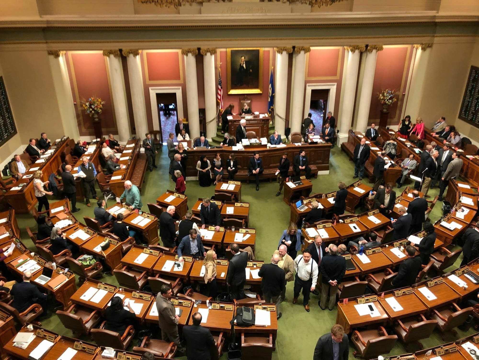 Representatives gather on the floor of the Minnesota House