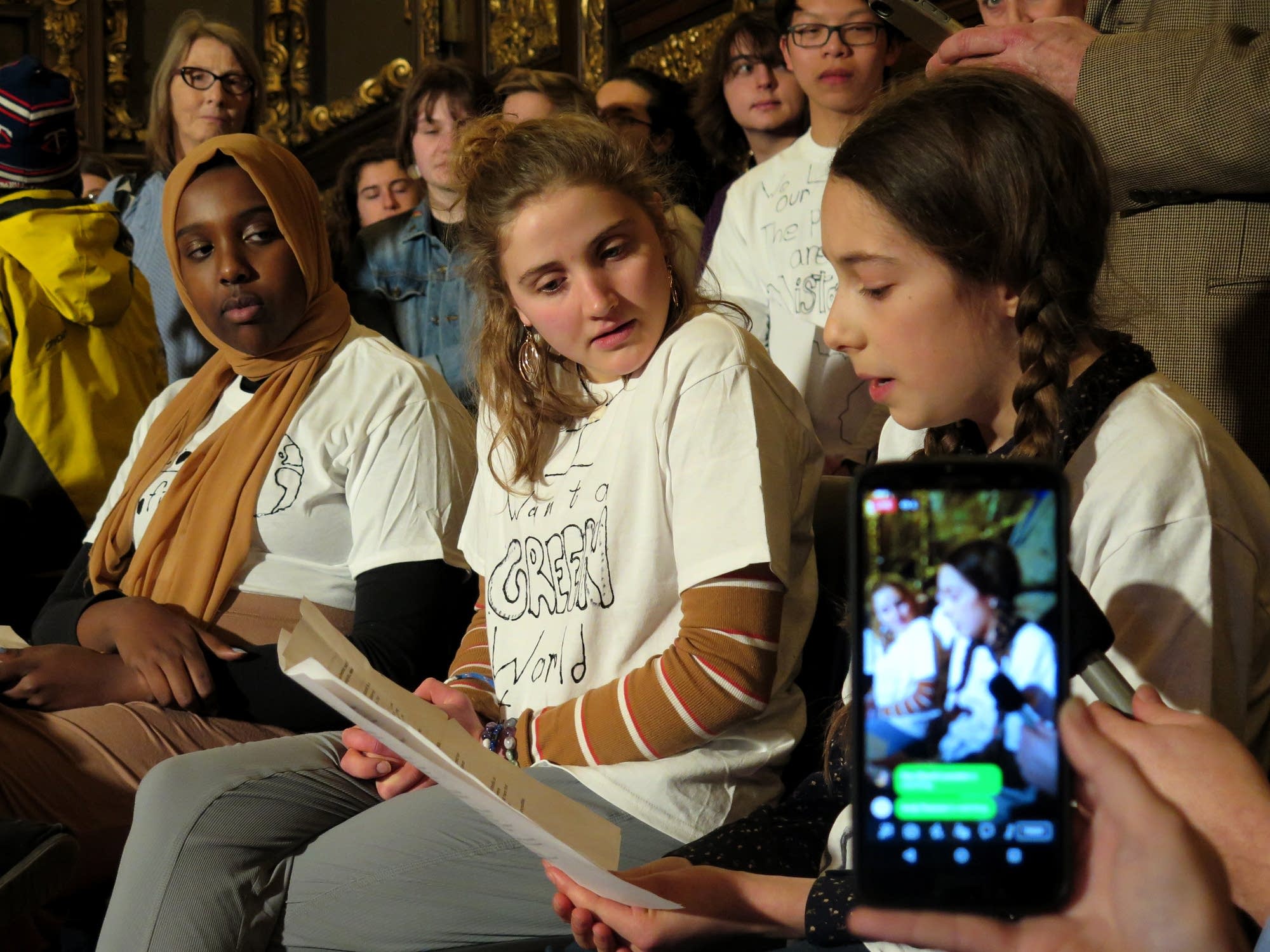 Thirteen-year-old Olya Wright reads a statement on youth climate action.