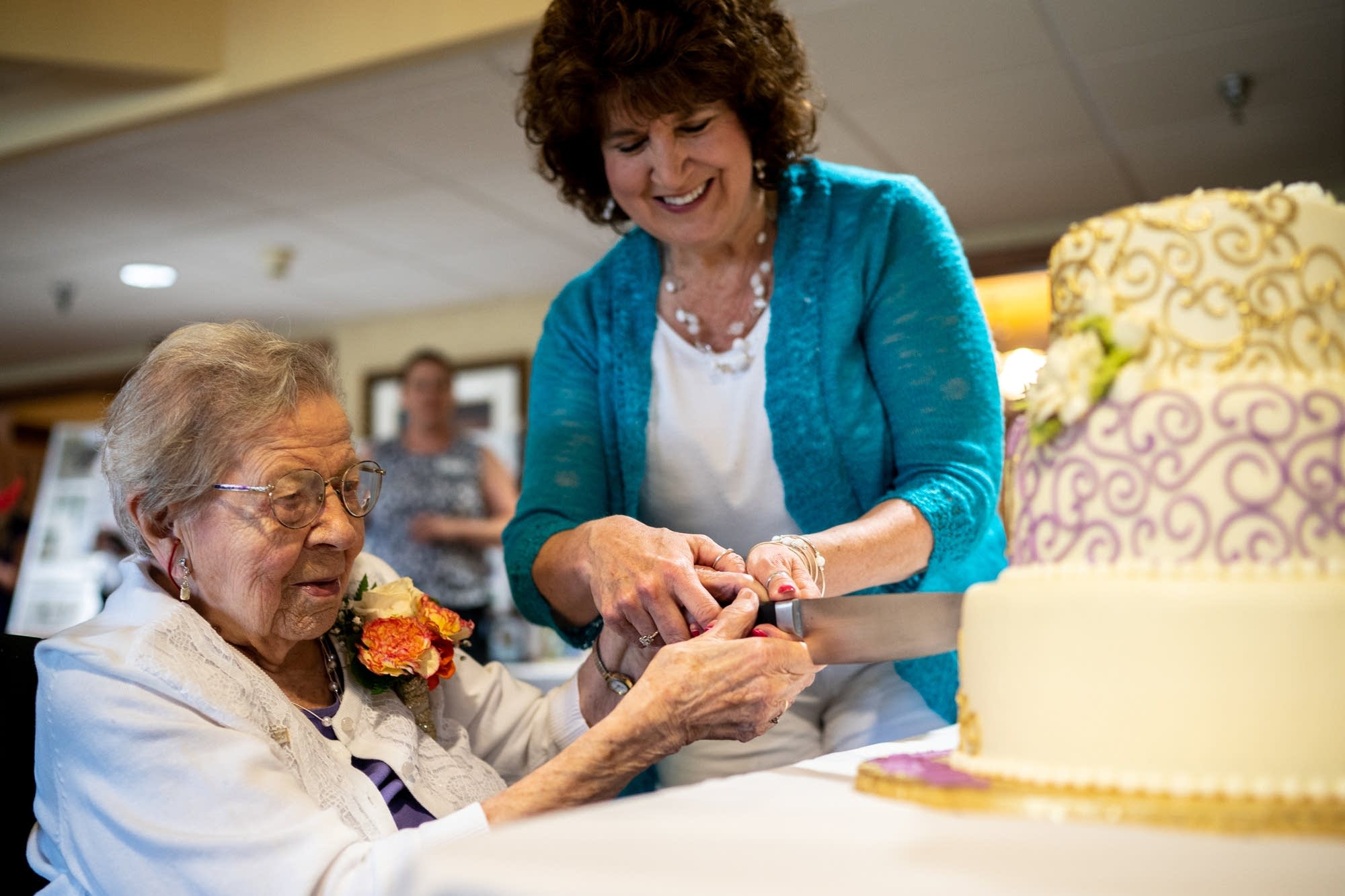 Evelyn Kleine cuts into her birthday cake.