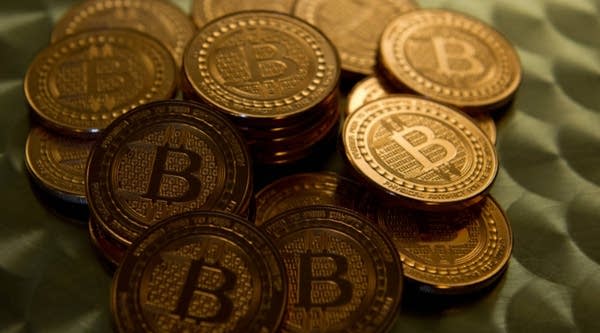 A view of bitcoin medals. Bitcoin uses peer-to-peer technology to operate with no central authority or banks.