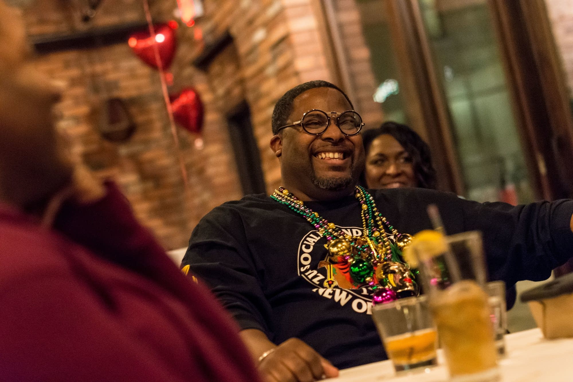 Raazon King of Minneapolis laughs while attending Dessert and Discussion.