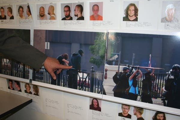 Fletcher points to pictures of RNC protesters