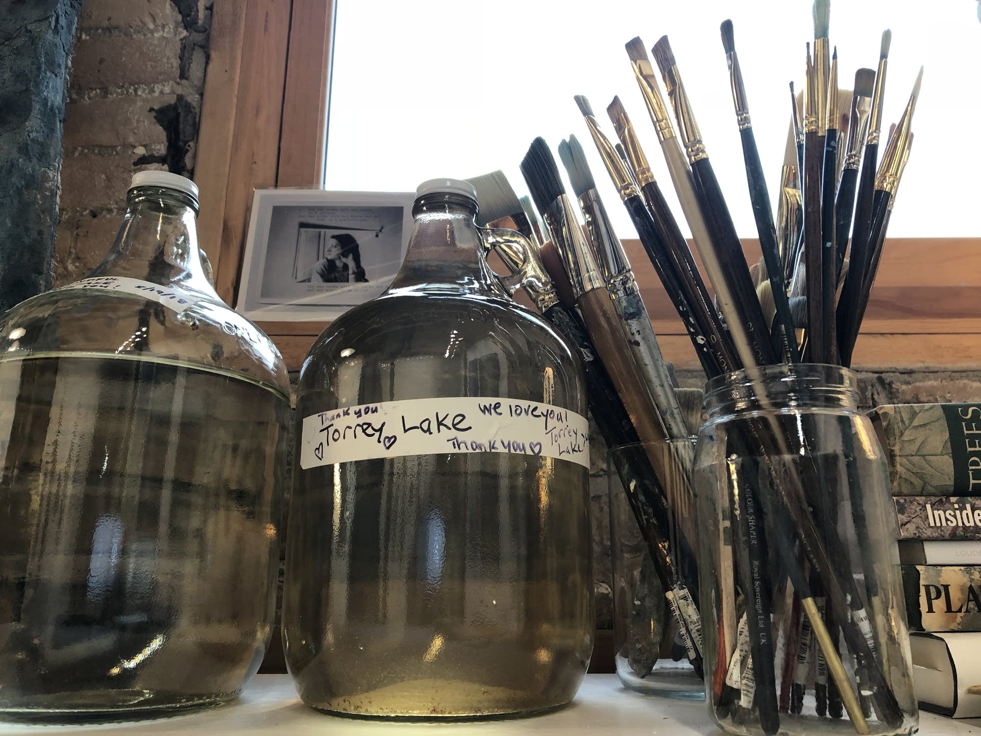 Annie Hejny's studio in Minneapolis features jugs of water.