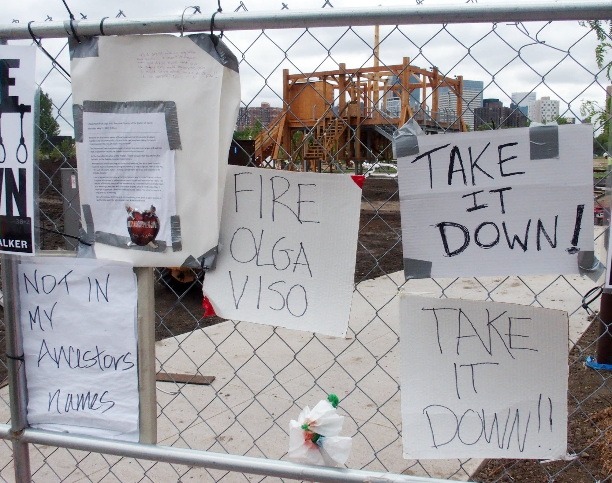 Protest banners line the fence outside the Minneapolis Sculpture Garden.