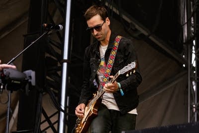 laamar and his band performing on stage