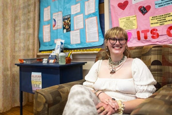 A student sits in a comfy armchair