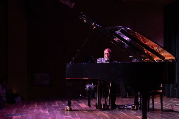 person playing concert piano