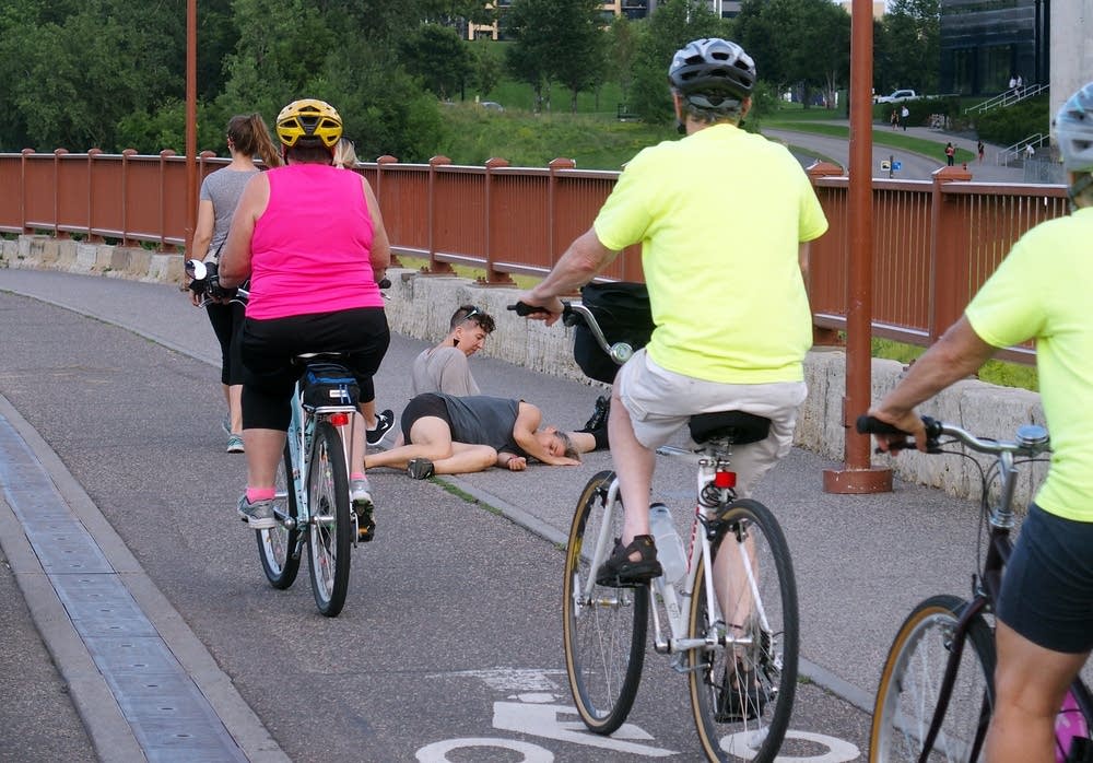 Cyclists rode past dancer Olive Bieringa.