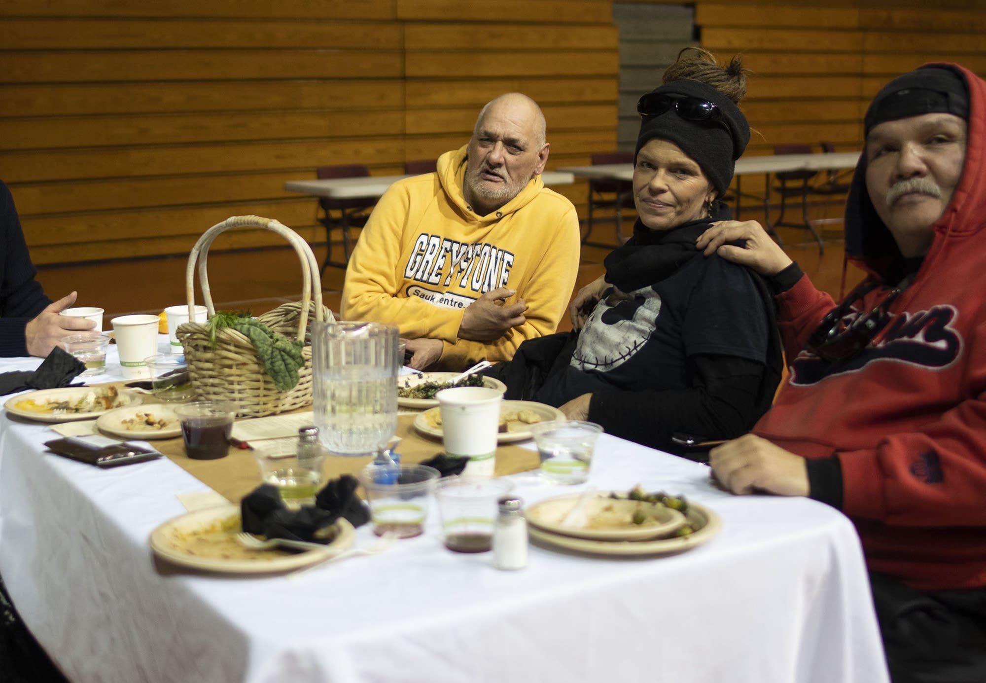 Residents of the navigation center gather for a community feast.