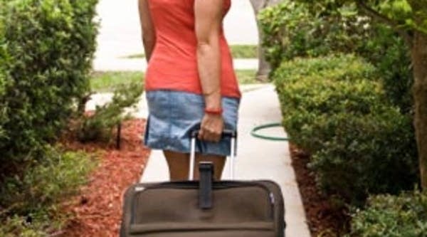 Woman with suitcase.