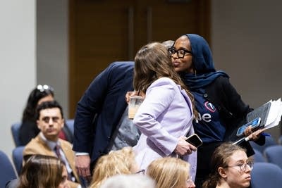 Two women embrace