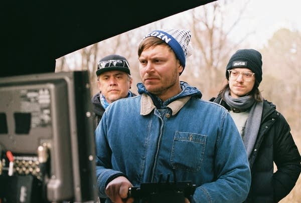 A man looks at a screen while creating a film.