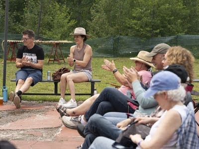 Crowd clapping and smiling
