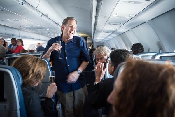 Champagne toasts ad the orchestra headed to Cuba.