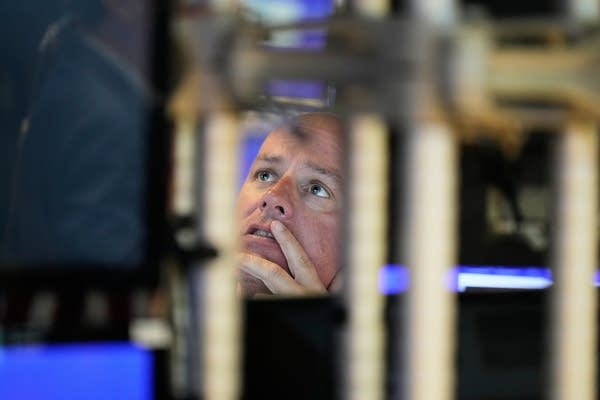 Wall Street's feverish rally takes a break as U.S. stocks and gold pull back from their records