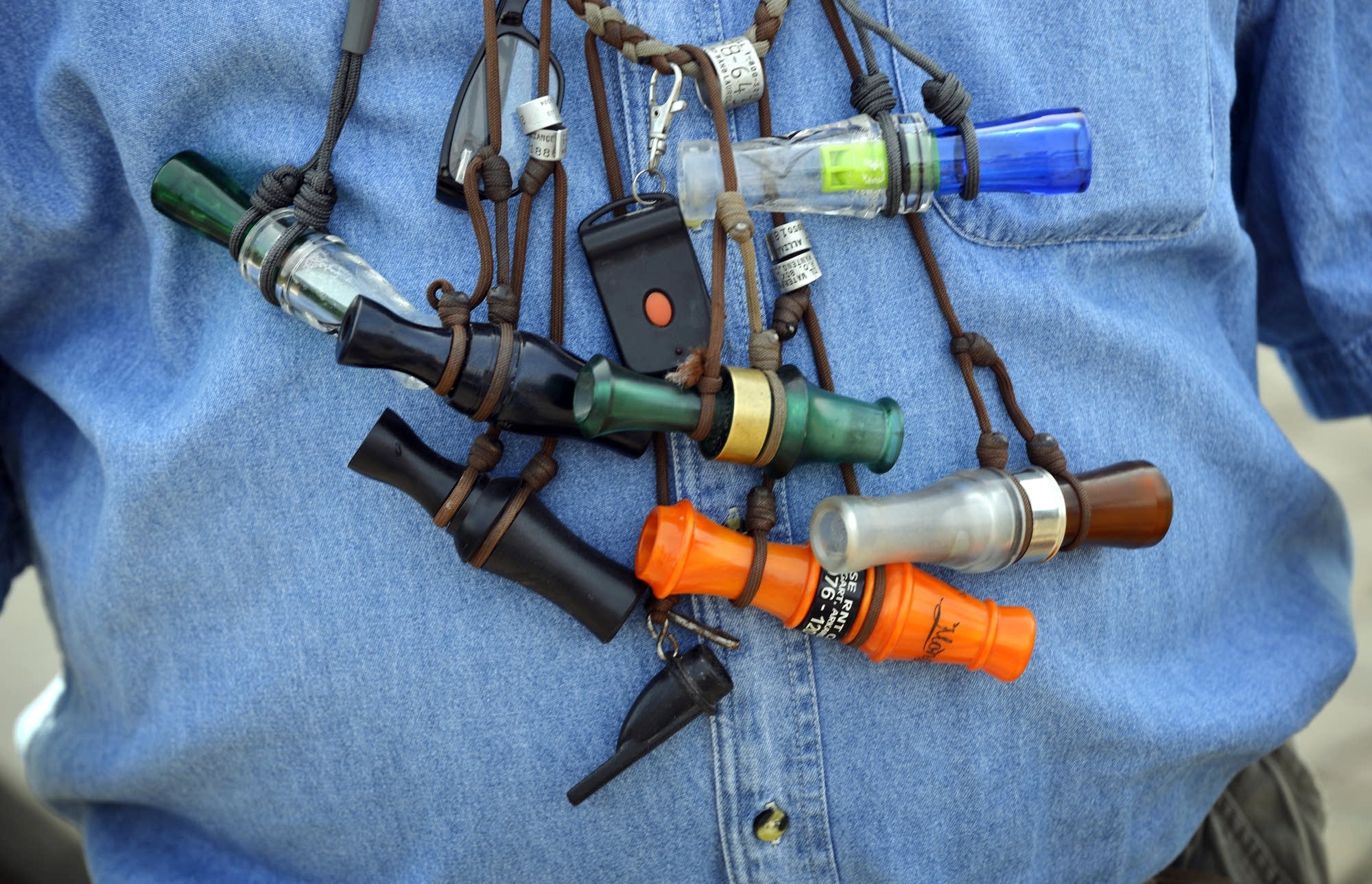 Duck and goose calls hang from Schroer's neck as he leads a workshop.