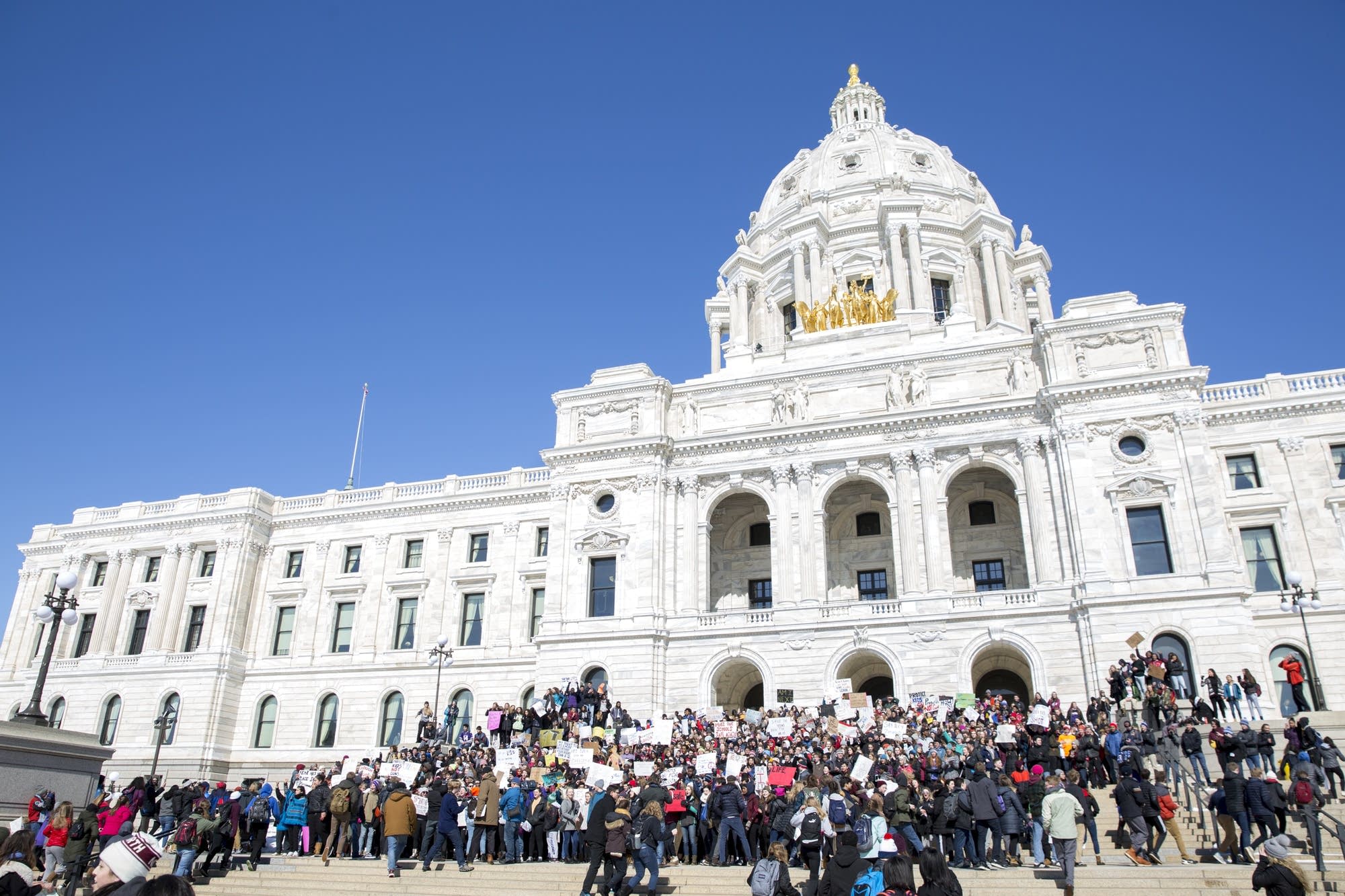 Hundreds of high school students occupy the steps of the State Capitol
