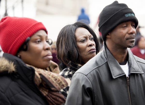 Christina Wilson, center, attends the rally at the capitol.