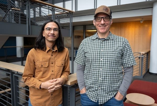 two men posing for a portrait