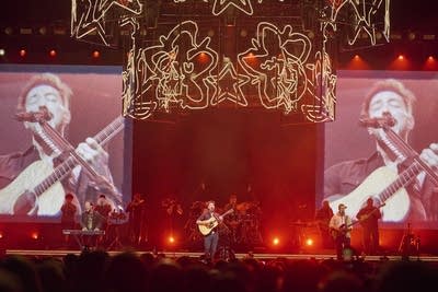 Mumford & Sons performing on stage