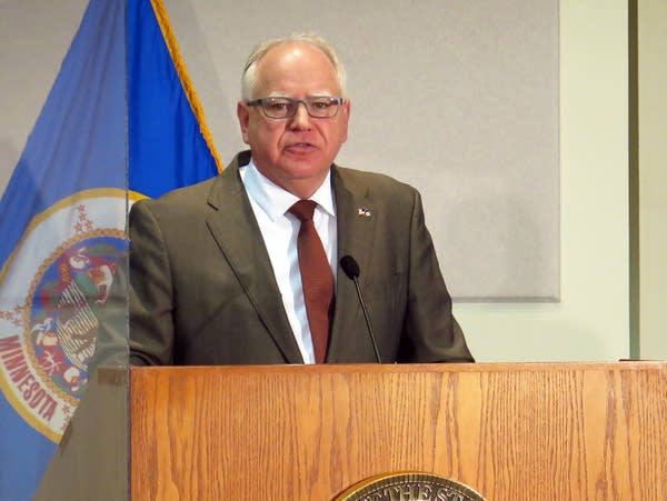 A man on a podium speaks.